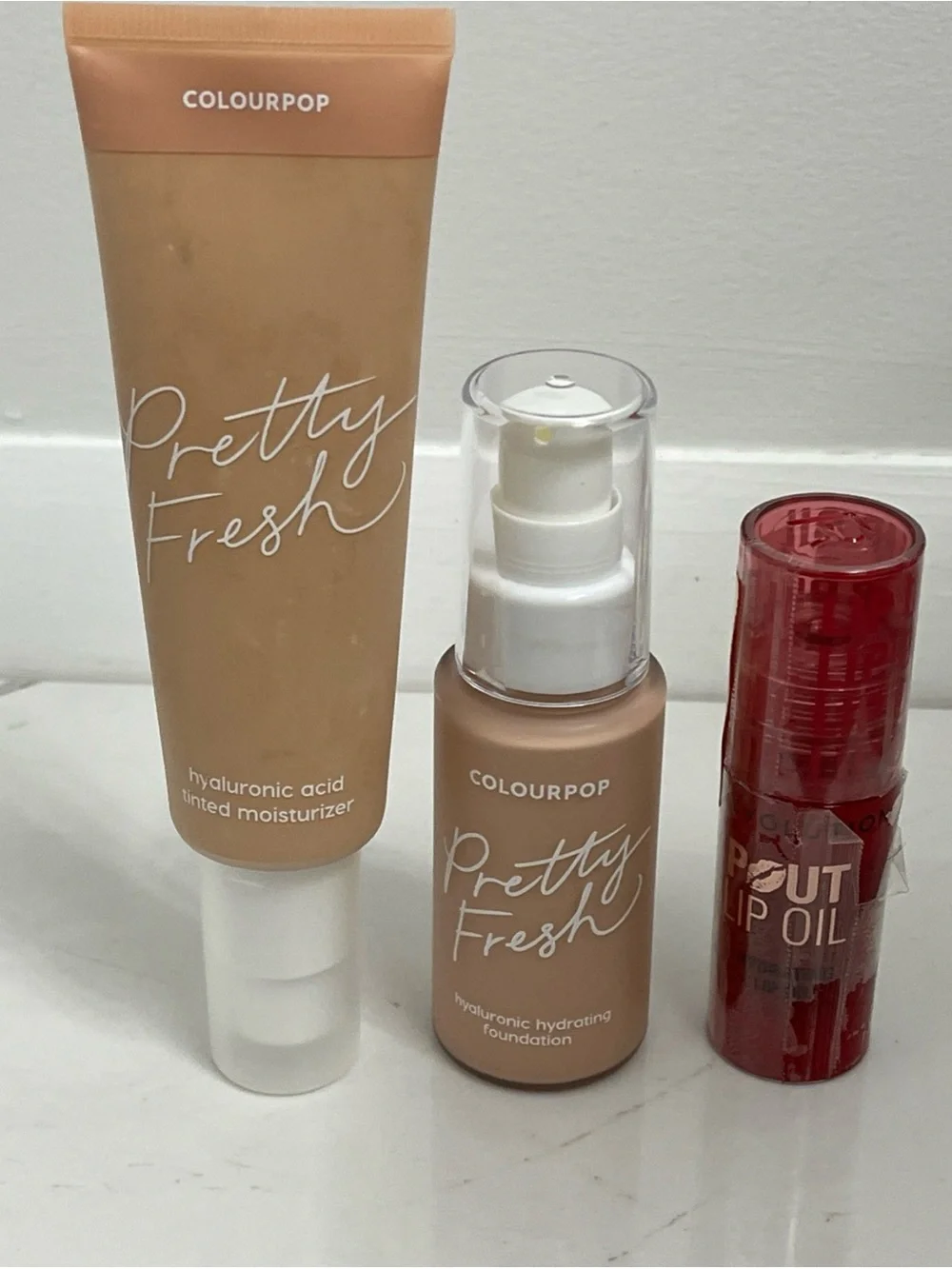 Colourpop cosmetics makeup lot tinted moisturizer foundation and lip oil